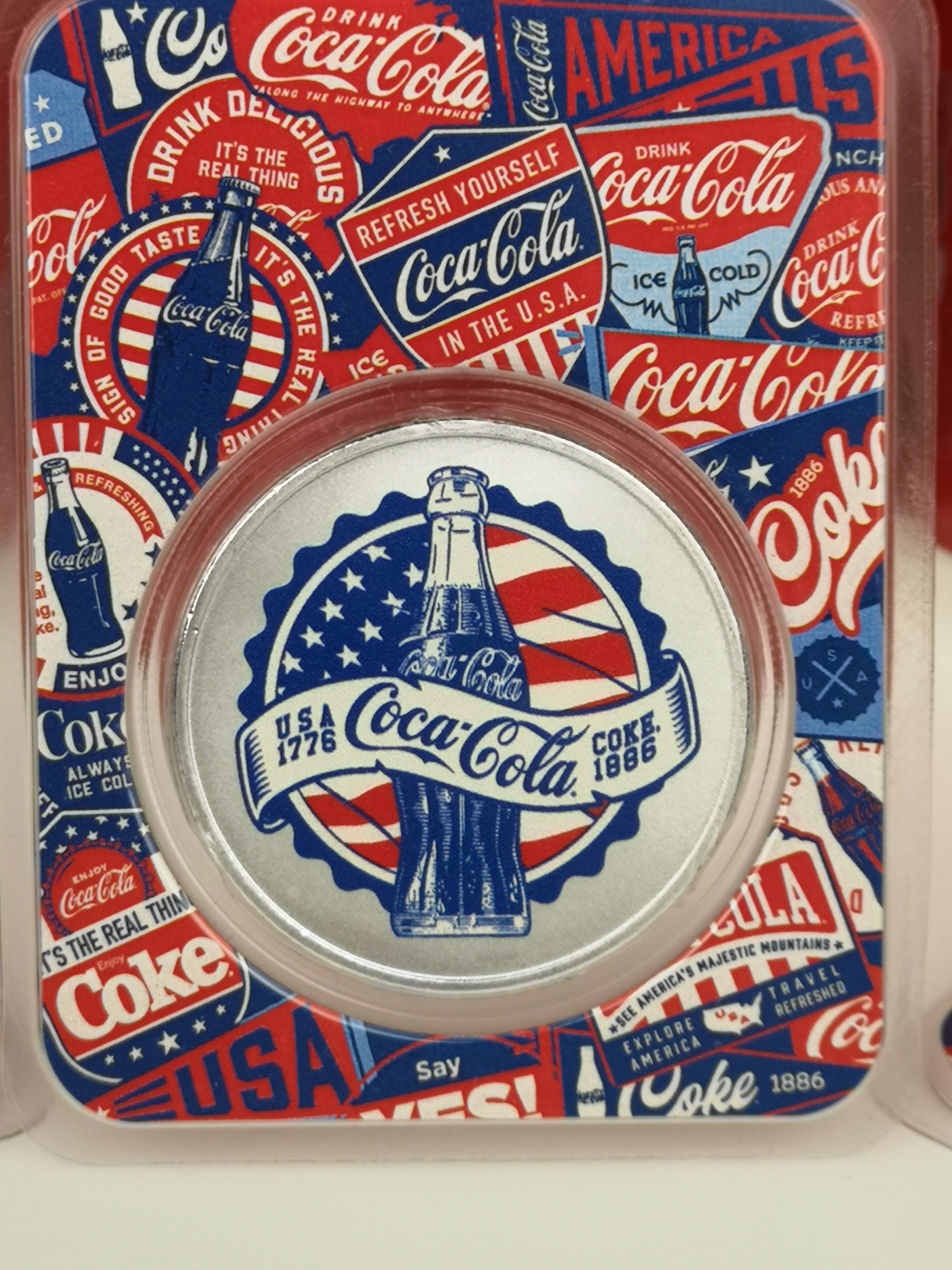 2026 Coca-Cola 140th Anniversary 1oz .999 silver round obverse colorized Americana design in collector packaging
