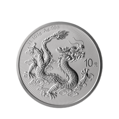 A round silver coin featuring an embossed dragon design, photographed on a plain white background.